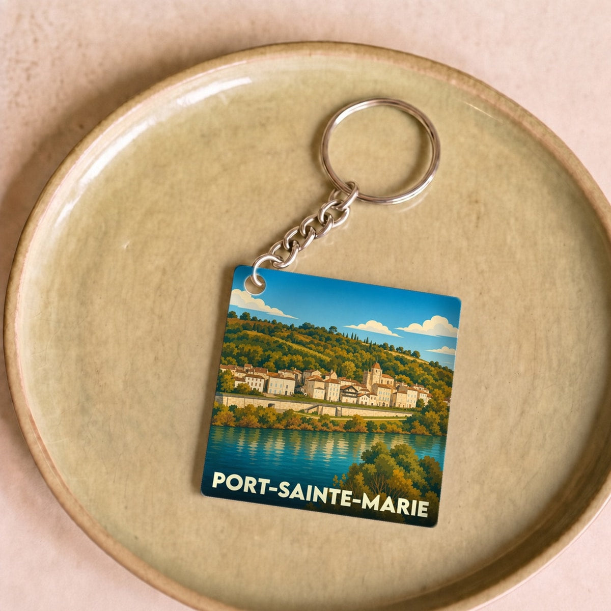 Porte-clés souvenir de la ville de Port-Sainte-Marie avec une illustration stylisée.