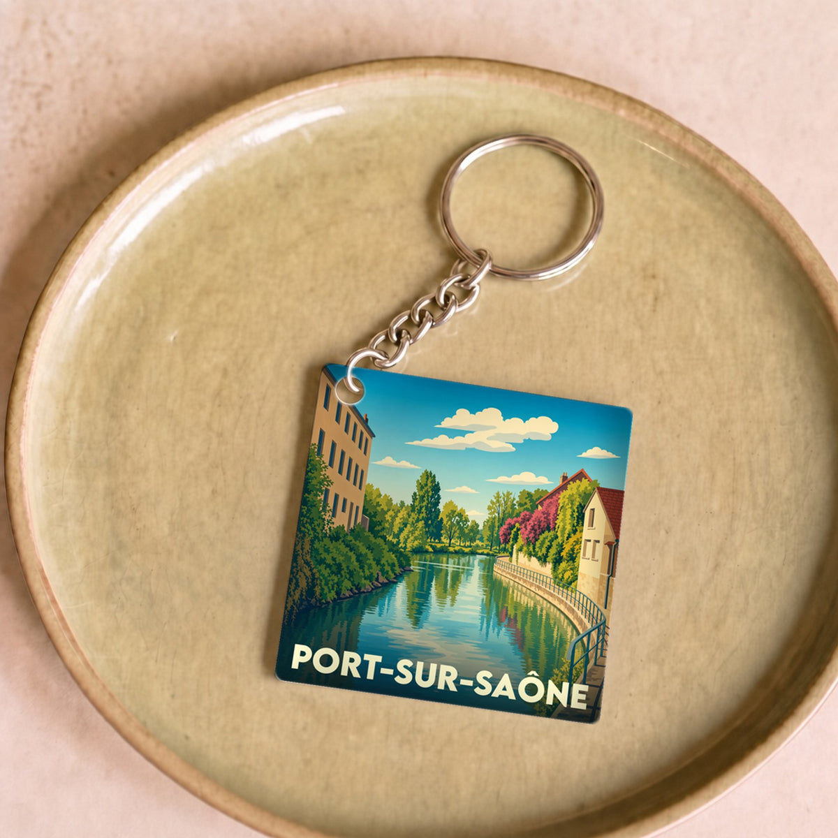 Porte-clés souvenir de la ville de Port-sur-Saône avec une illustration stylisée.