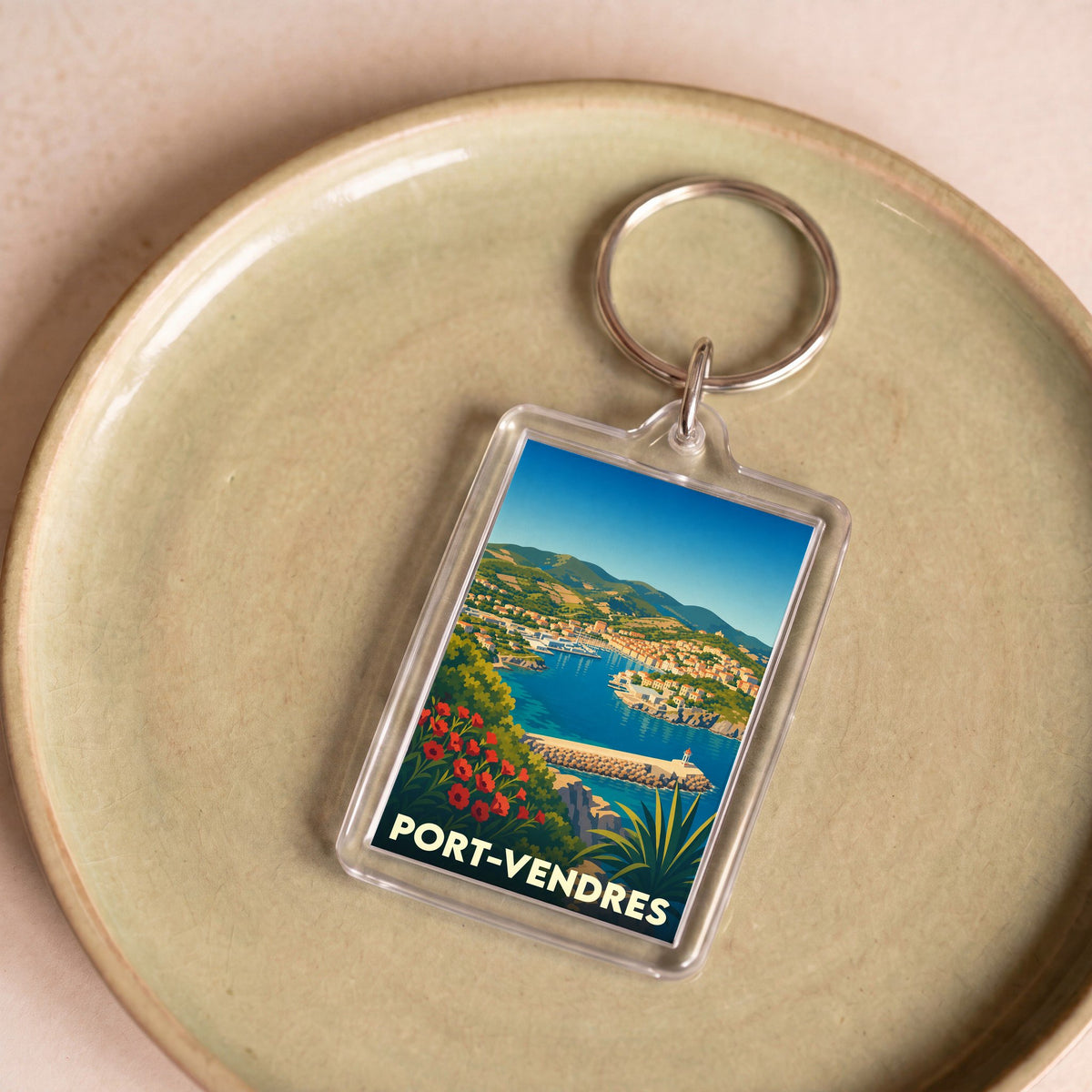 Porte-clés souvenir de la ville de Port-Vendres avec une illustration stylisée.