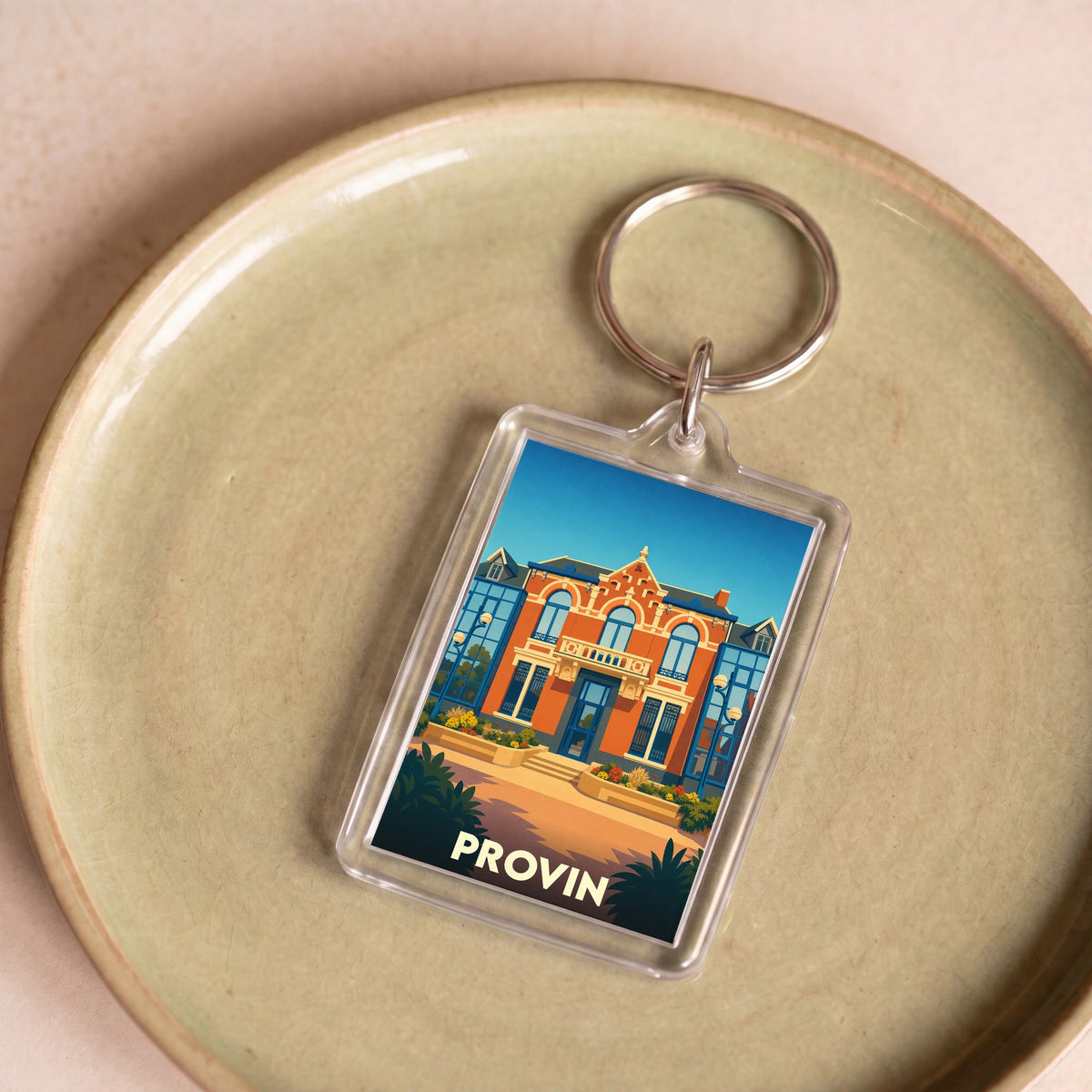 Porte-clés souvenir de la ville de Provin avec une illustration stylisée d'un bâtiment remarquable.