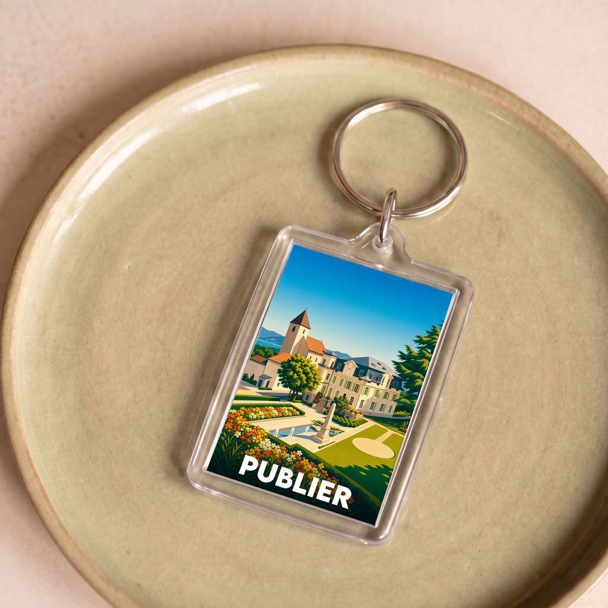 Porte-clés souvenir de la ville de Publier avec une illustration stylisée de son architecture.