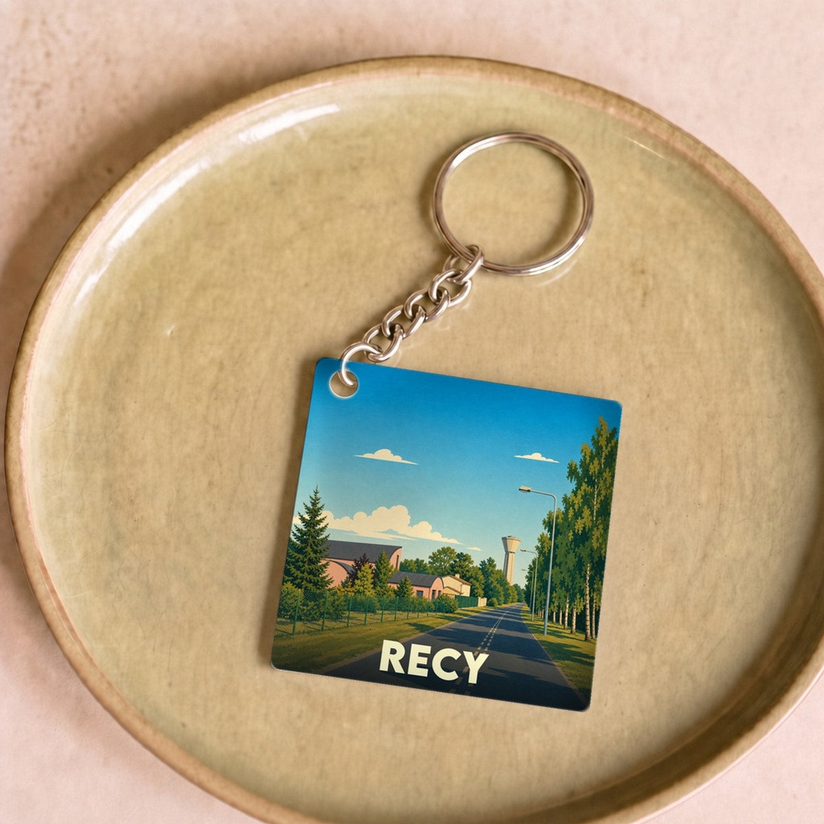Porte-clés souvenir de la ville de Recy avec une illustration stylisée.