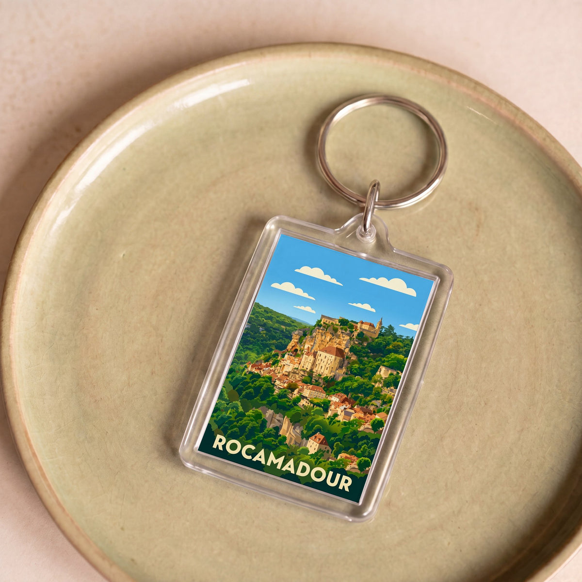 Porte-clés souvenir de la ville de Rocamadour avec une illustration stylisée.