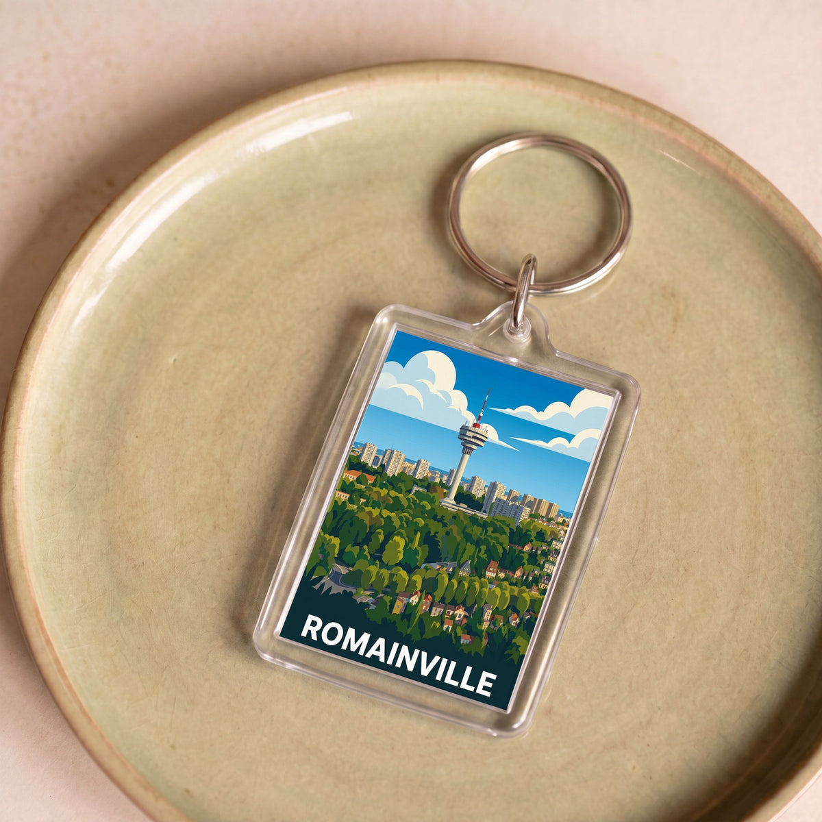 Porte-clés souvenir de la ville de Romainville avec une illustration stylisée.