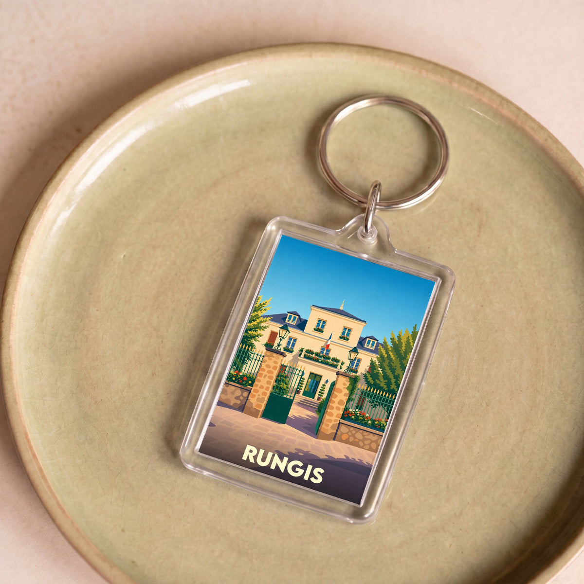 Porte-clés souvenir de la ville de Rungis avec une illustration stylisée de l'hôtel de ville.