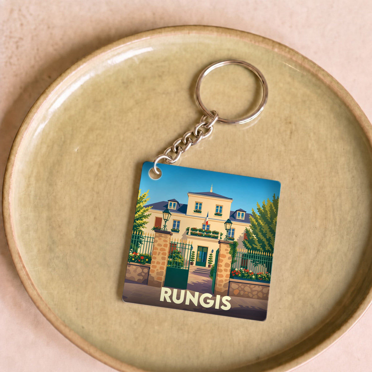 Porte-clés souvenir de la ville de Rungis avec une illustration stylisée de l'hôtel de ville.