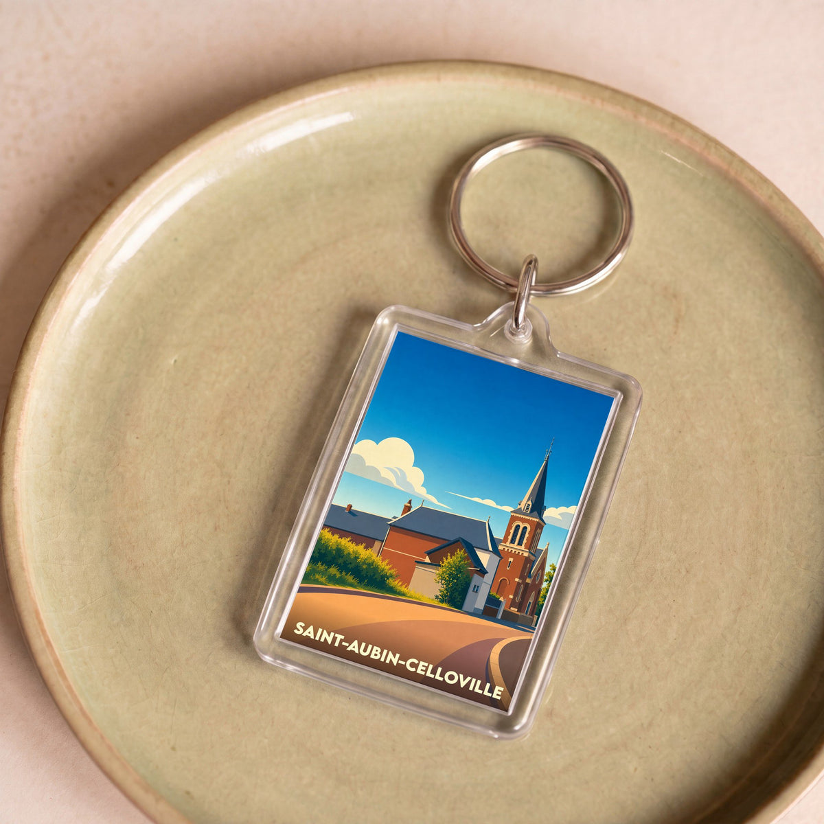 Porte-clés souvenir de la ville de Saint-Aubin-Celloville avec une illustration stylisée de son église.
