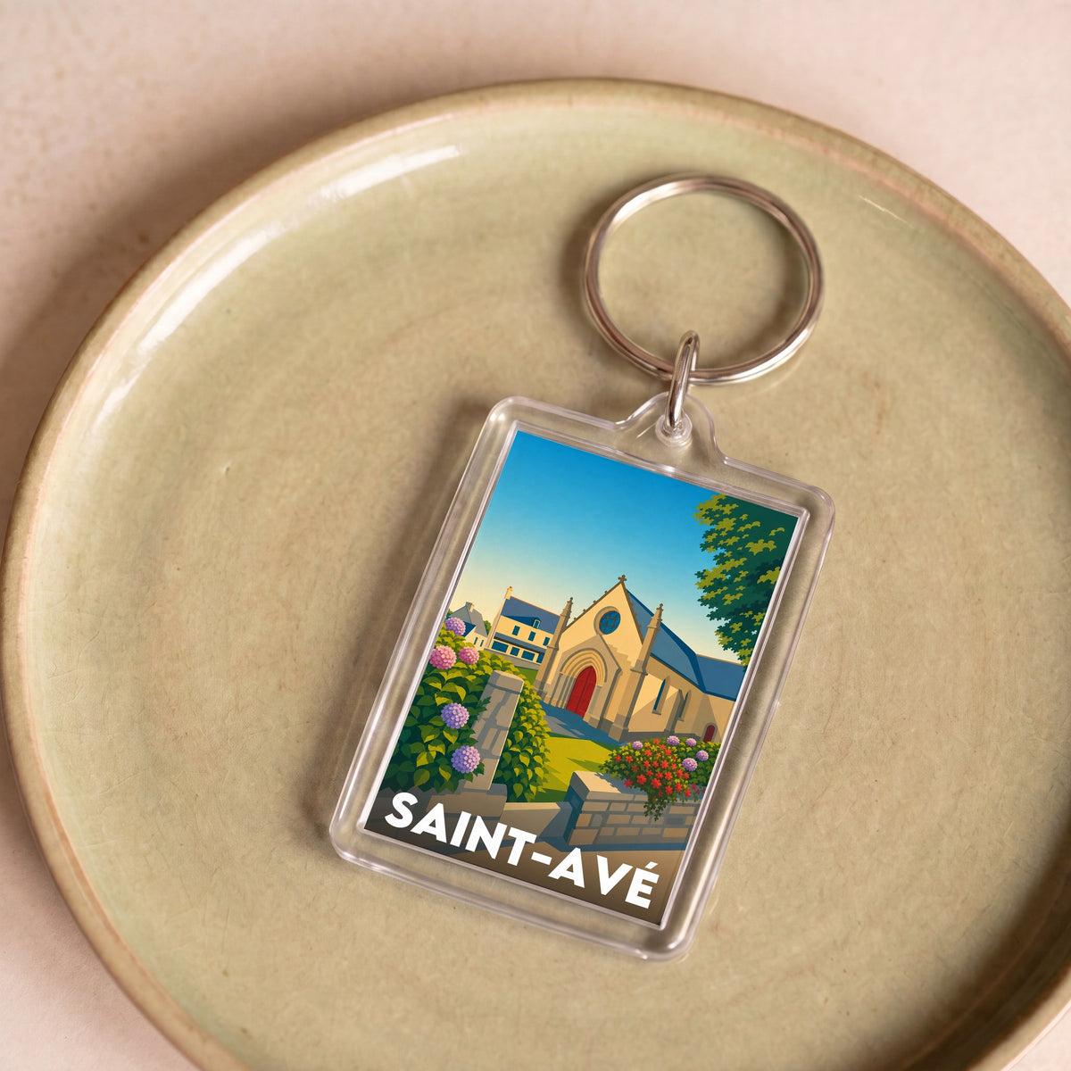 Porte-clés souvenir de la ville de Saint-Avé avec une illustration stylisée.