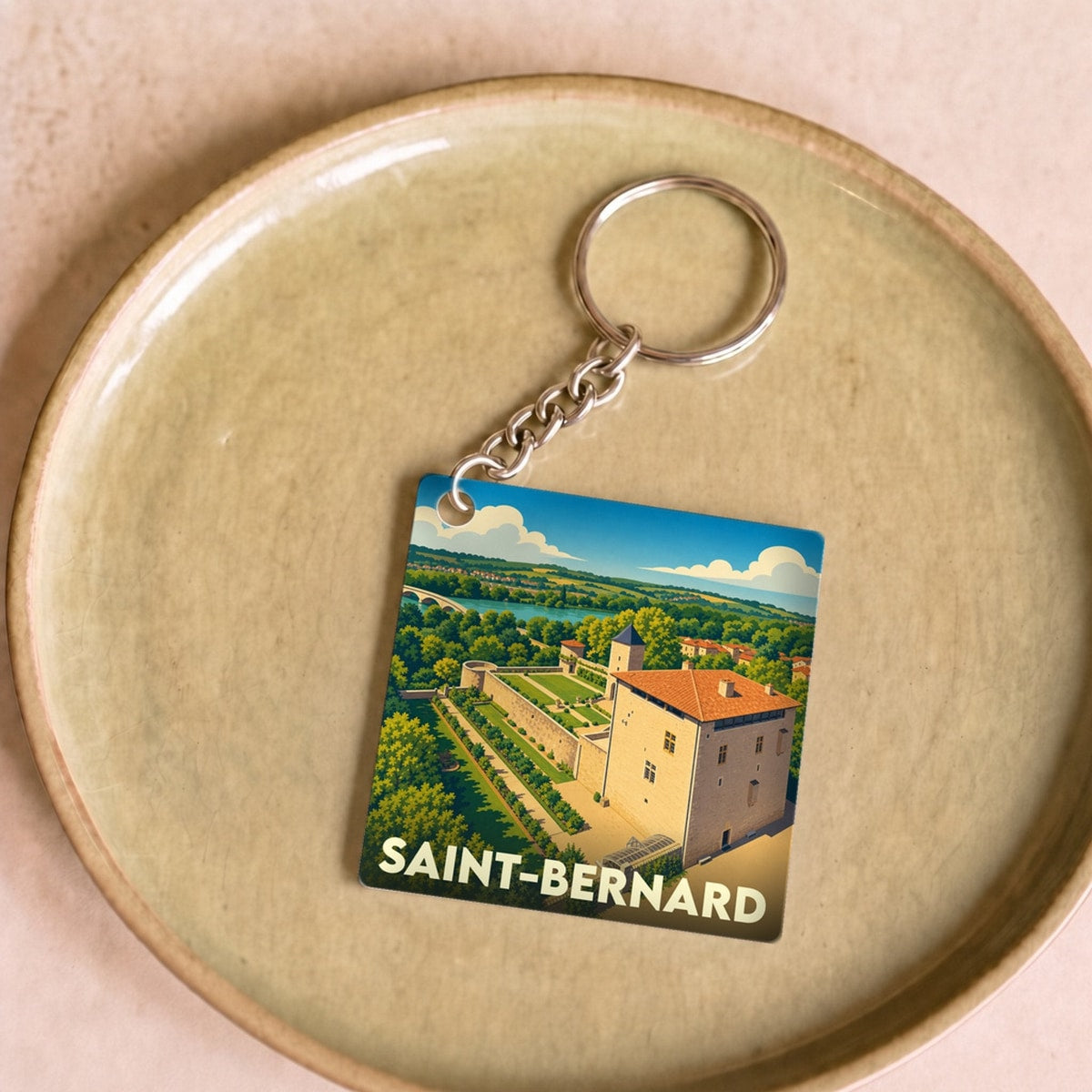 Porte-clés souvenir de la ville de Saint-Bernard avec une illustration stylisée.