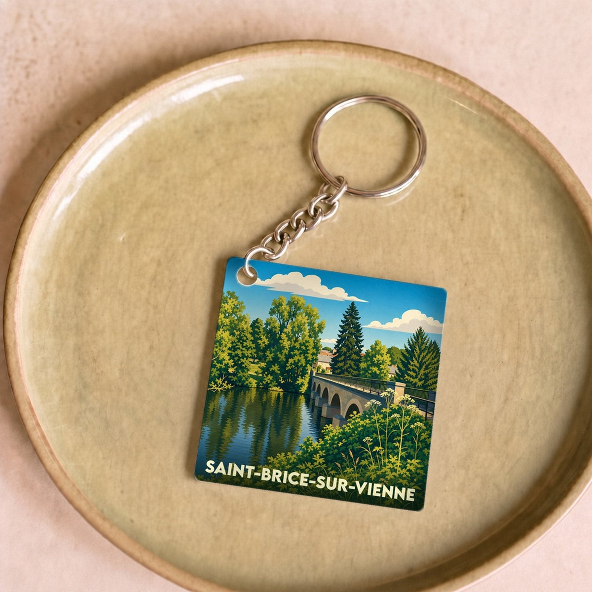 Porte-clés souvenir de la ville de Saint-Brice-sur-Vienne avec une illustration stylisée.