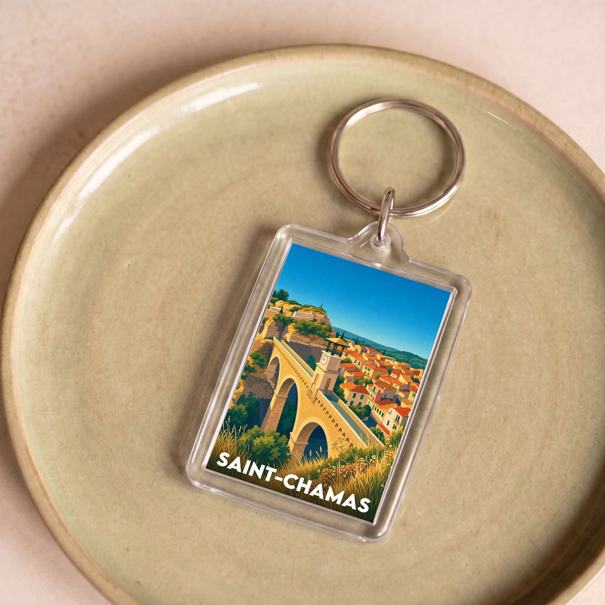 Porte-clés souvenir de la ville de Saint-Chamas avec une illustration stylisée.