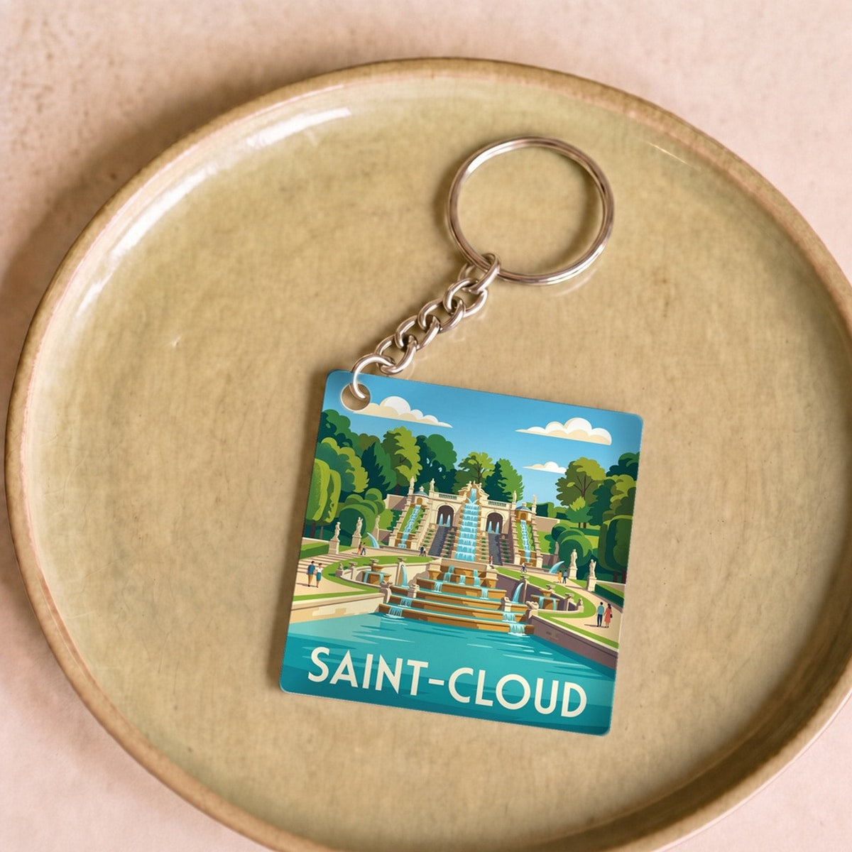 Porte-clés souvenir de la ville de Saint-Cloud avec une illustration stylisée.
