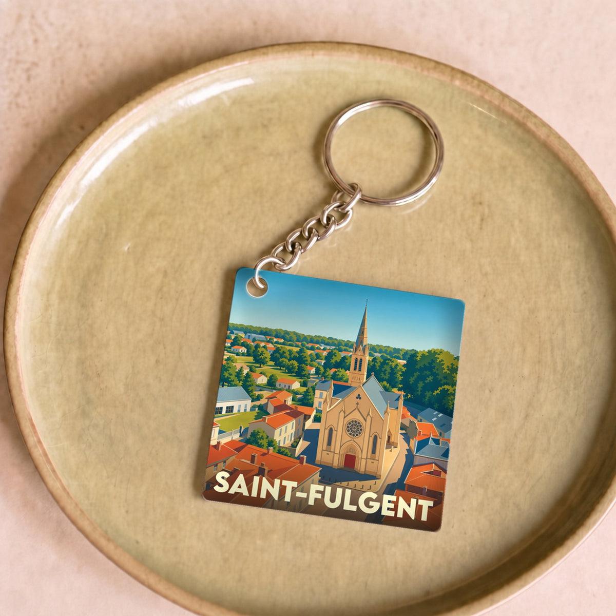 Porte-clés souvenir de la ville de Saint-Fulgent avec une illustration stylisée.