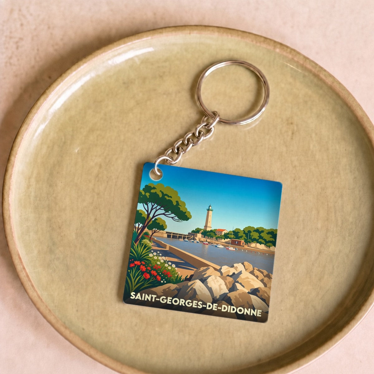 Porte-clés souvenir de la ville de Saint-Georges-de-Didonne avec une illustration stylisée.