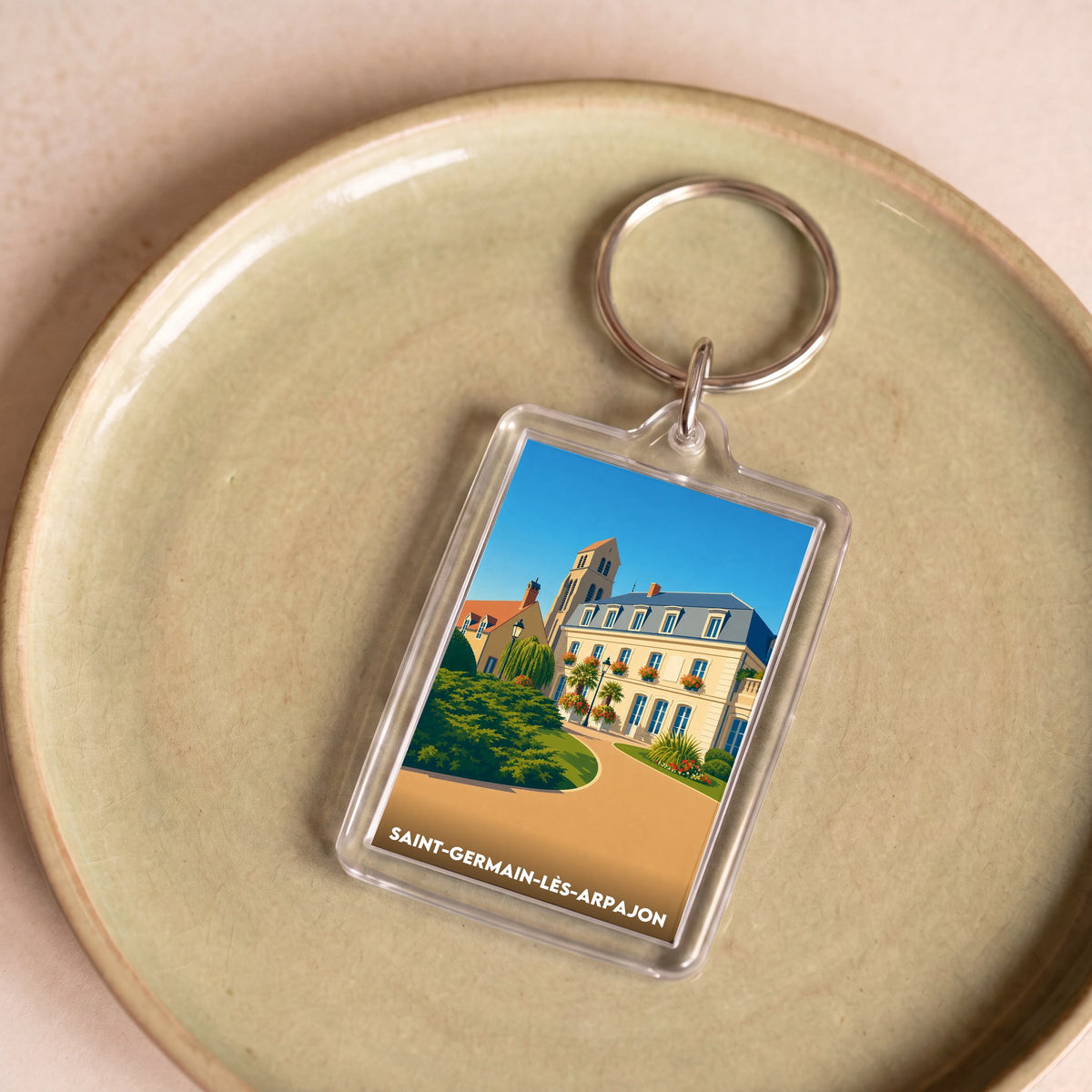 Porte-clés souvenir de la ville de Saint-Germain-lès-Arpajon avec une illustration stylisée.
