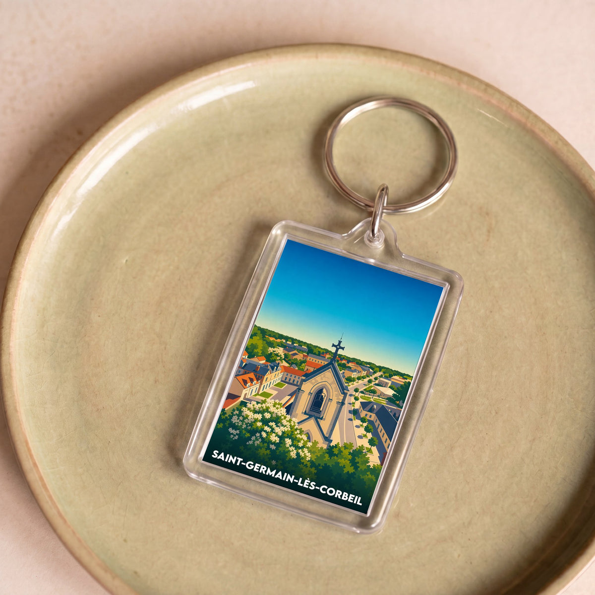 Porte-clés souvenir de la ville de Saint-Germain-lès-Corbeil avec une illustration stylisée.