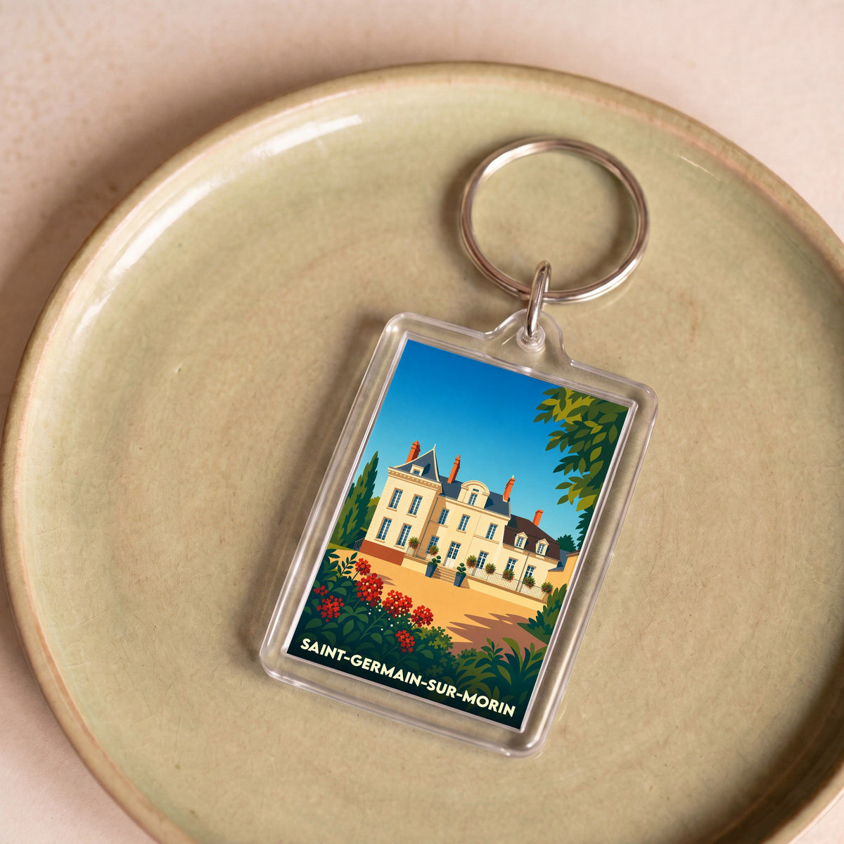 Porte-clés souvenir de la ville de Saint-Germain-sur-Morin avec une illustration stylisée.