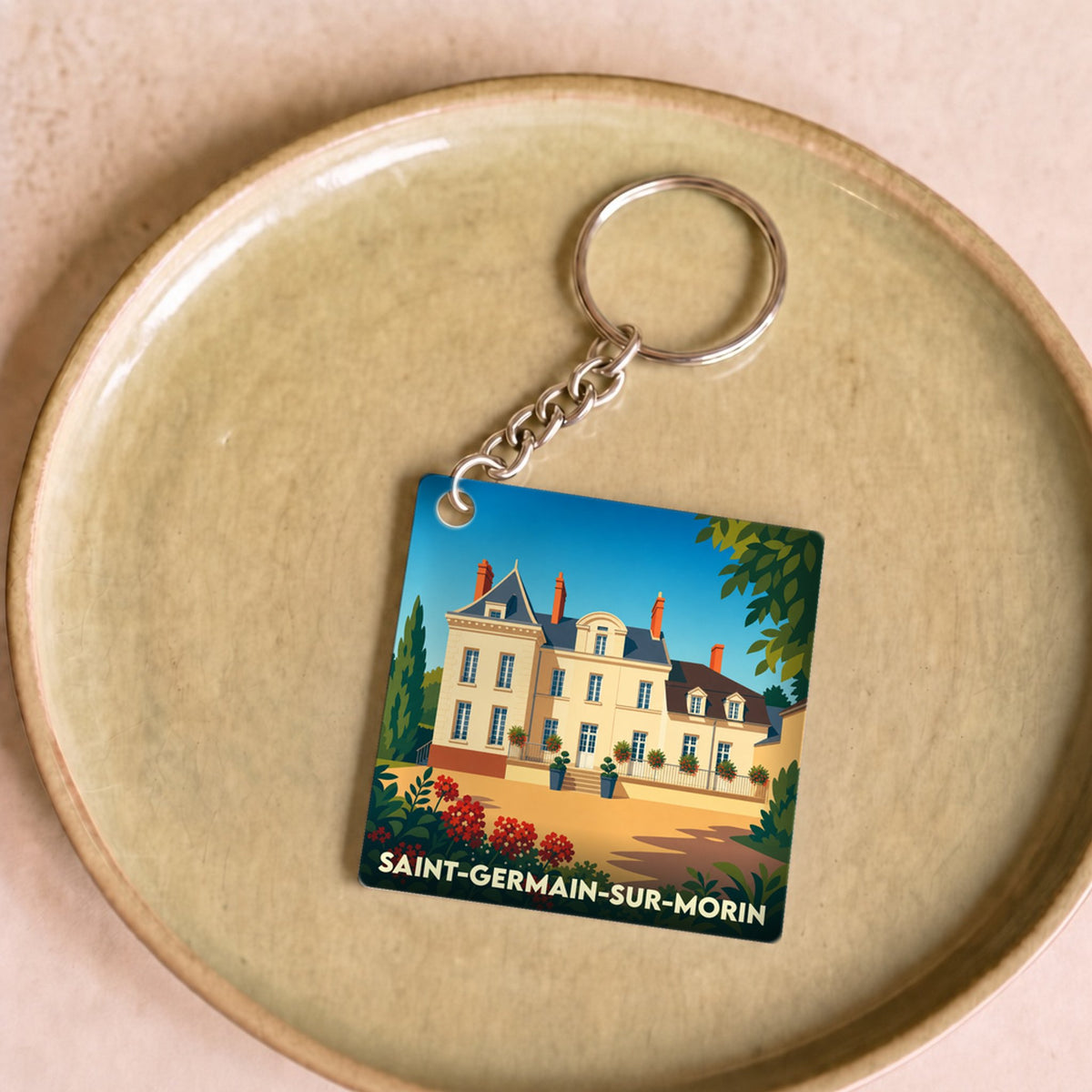 Porte-clés souvenir de la ville de Saint-Germain-sur-Morin avec une illustration stylisée.