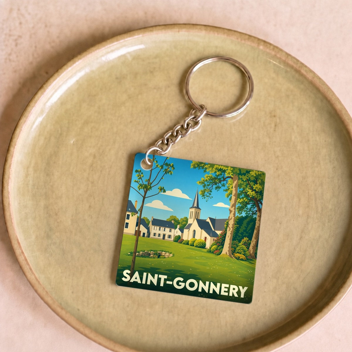 Porte-clés souvenir de la ville de Saint-Gonnery avec une illustration stylisée.