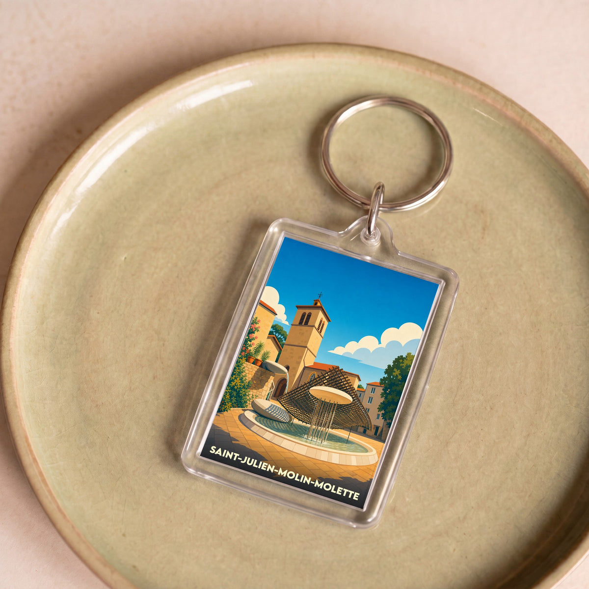 Porte-clés souvenir de la ville de Saint-Julien-Molin-Molette avec une illustration stylisée.