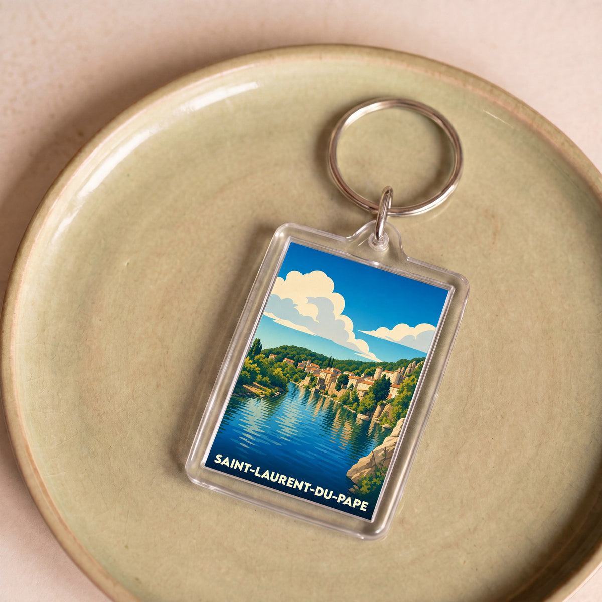 Porte-clés souvenir de la ville de Saint-Laurent-du-Pape avec une illustration stylisée.