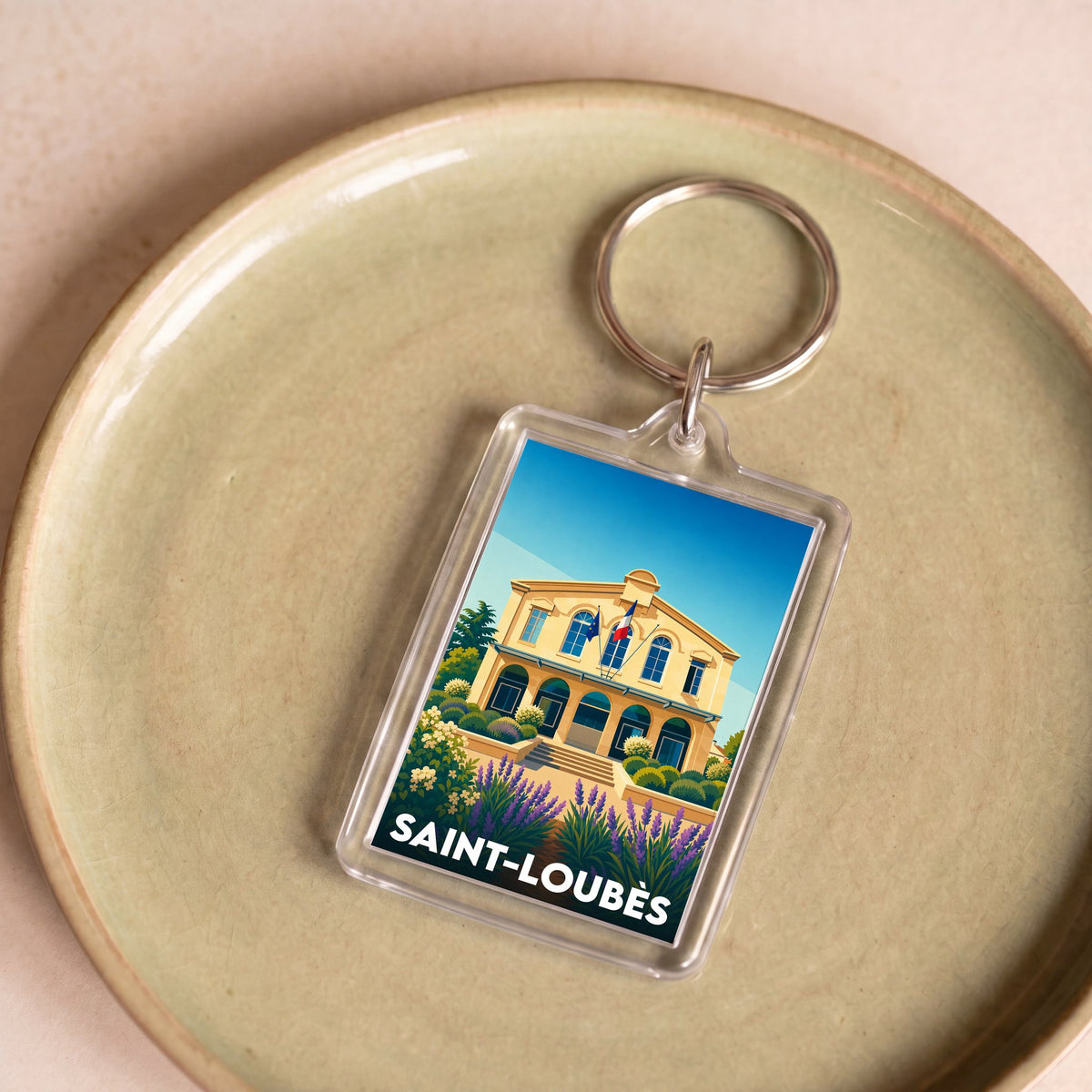 Porte-clés souvenir de la ville de Saint-Loubès avec une illustration colorée de l'hôtel de ville.