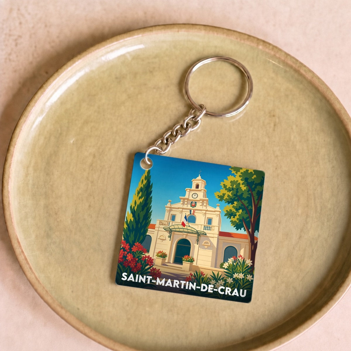 Porte-clés souvenir de la ville de Saint-Martin-de-Crau avec une illustration stylisée.