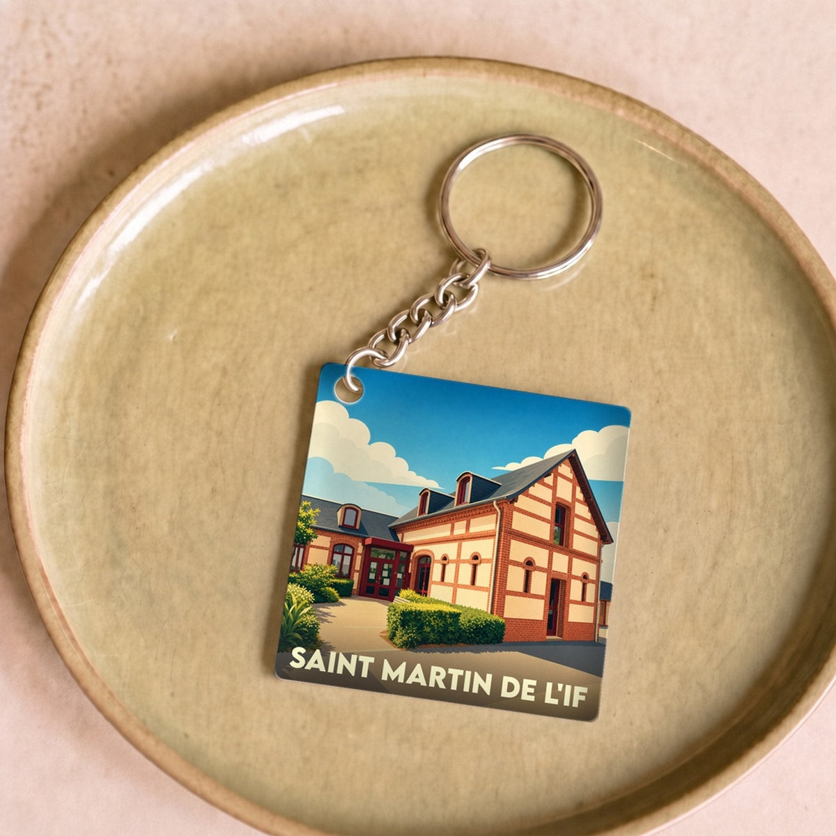 Porte-clés souvenir de la commune de Saint Martin de l'If avec une illustration stylisée.