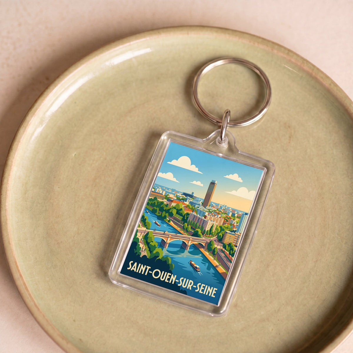 Porte-clés souvenir de la ville de Saint-Ouen-sur-Seine avec une illustration stylisée.