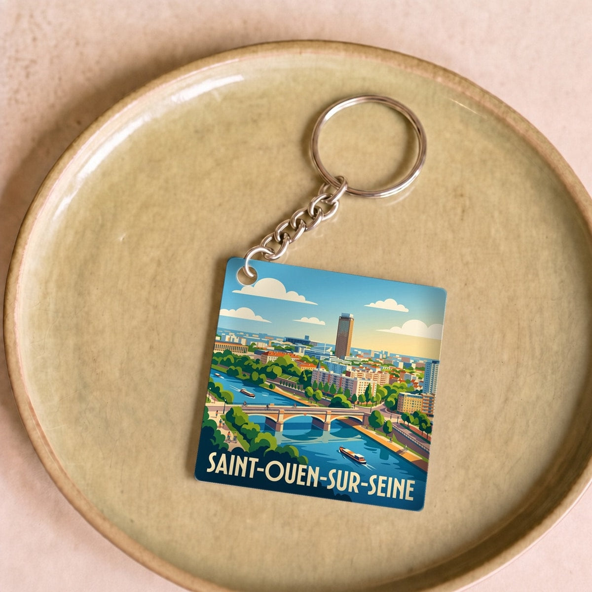 Porte-clés souvenir de la ville de Saint-Ouen-sur-Seine avec une illustration stylisée.