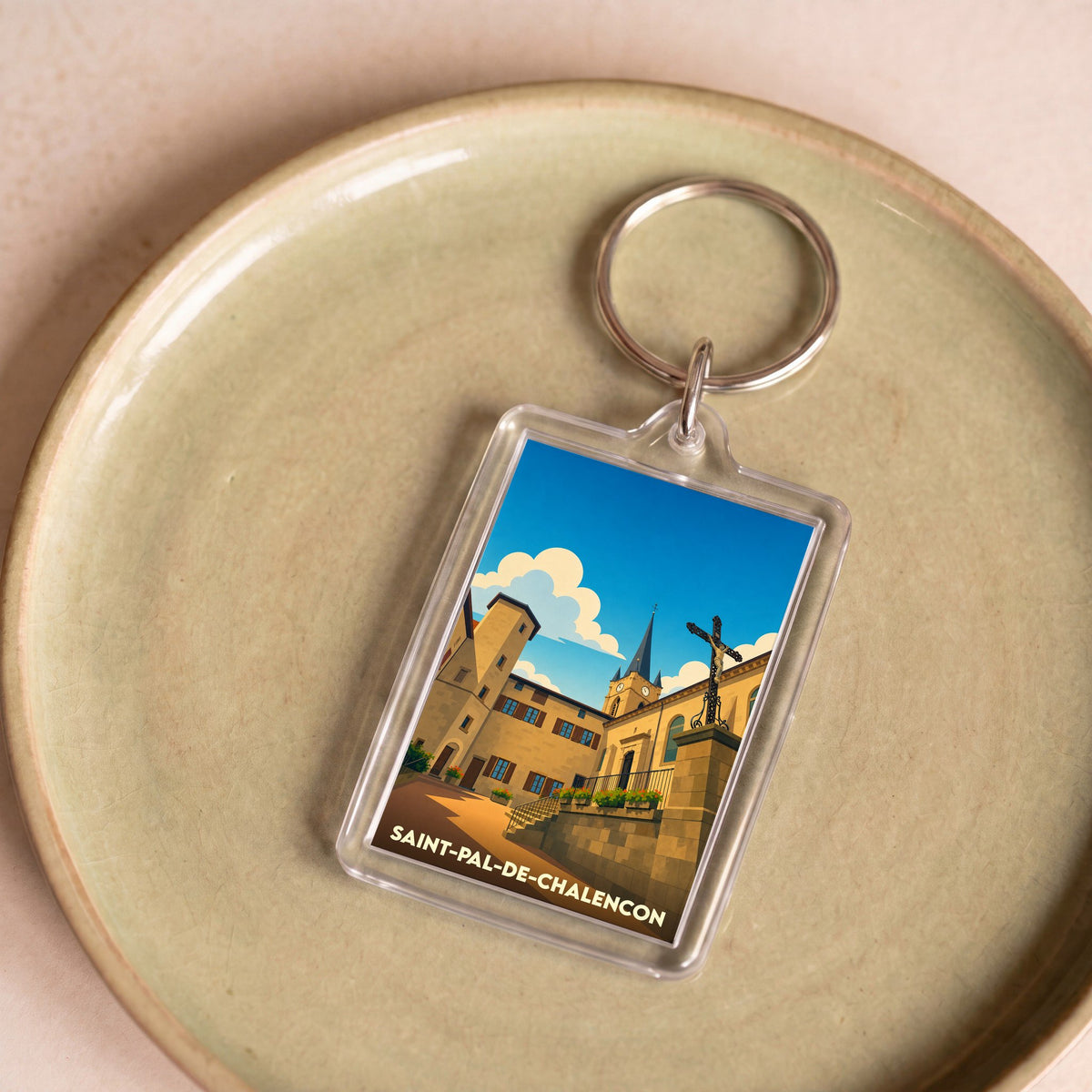 Porte-clés souvenir de la ville de Saint-Pal-de-Chalencon avec une illustration stylisée.