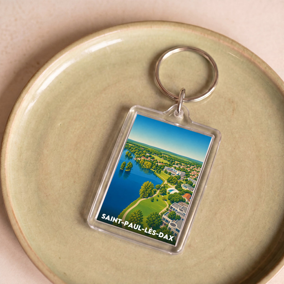 Porte-clés souvenir de la ville de Saint-Paul-lès-Dax avec une illustration stylisée.