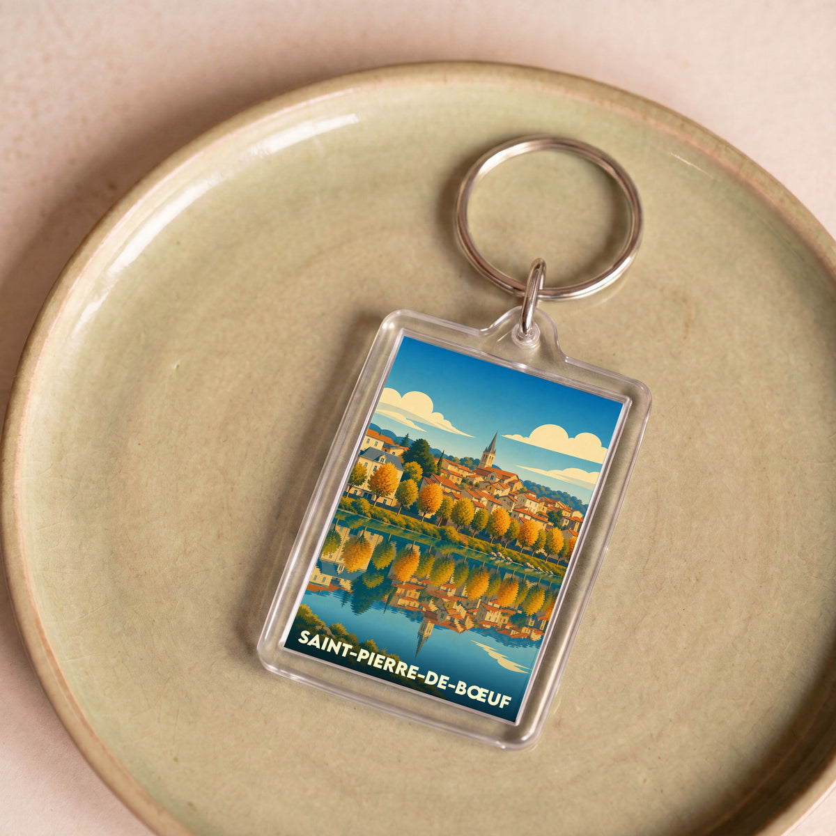 Porte-clés souvenir de la ville de Saint-Pierre-de-Bœuf avec une illustration stylisée.