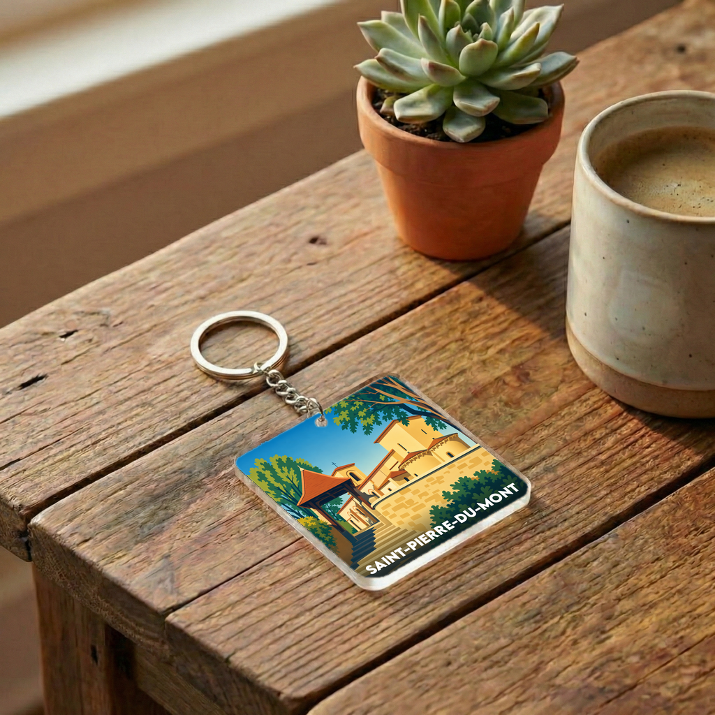 Porte-clés souvenir de la ville de Saint-Pierre-du-Mont avec une illustration stylisée.