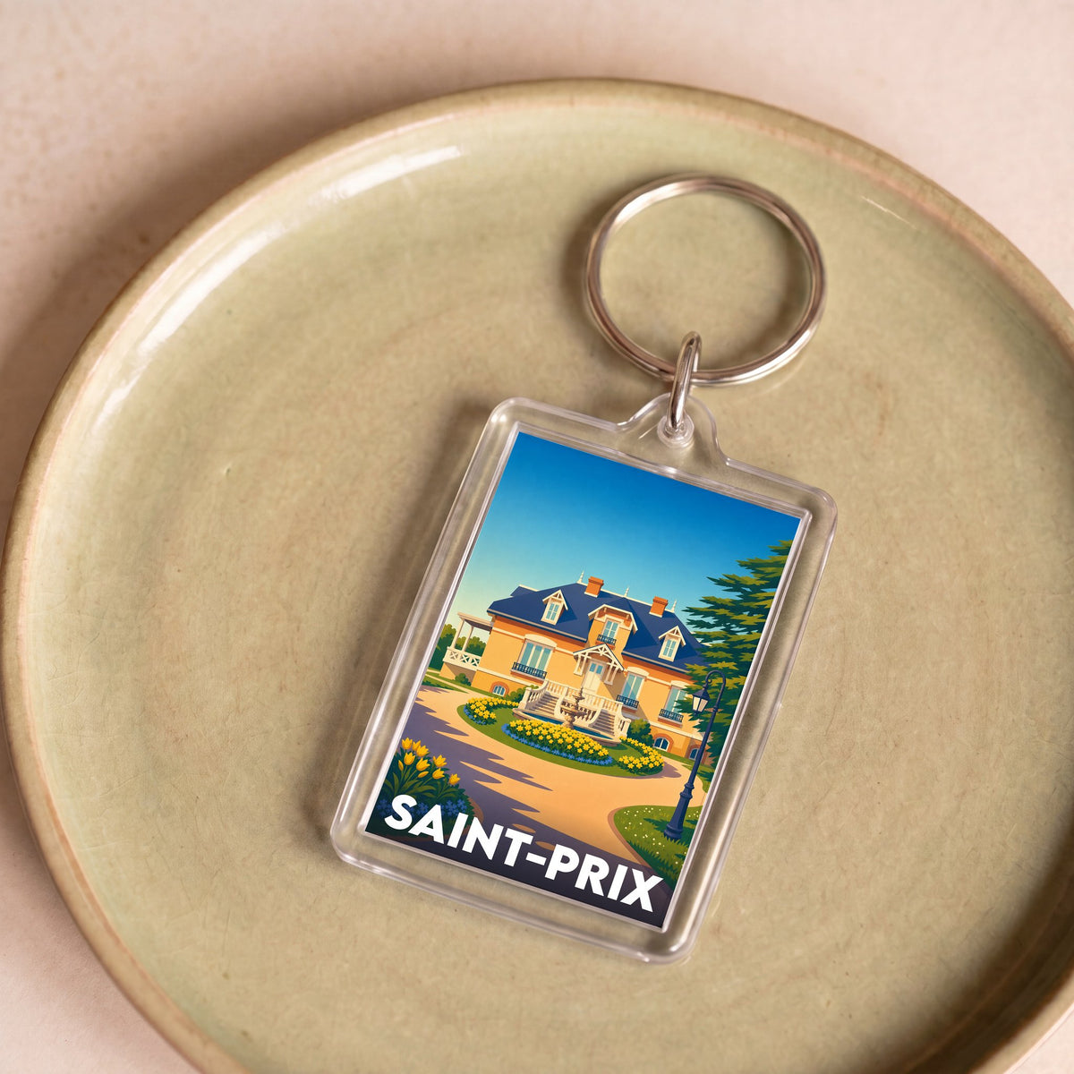 Porte-clés souvenir de la ville de Saint-Prix avec une illustration stylisée.