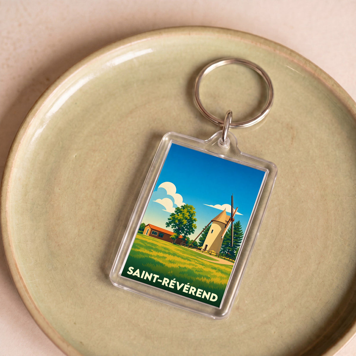 Porte-clés souvenir de la ville de Saint-Révérend avec une illustration stylisée d'un moulin.