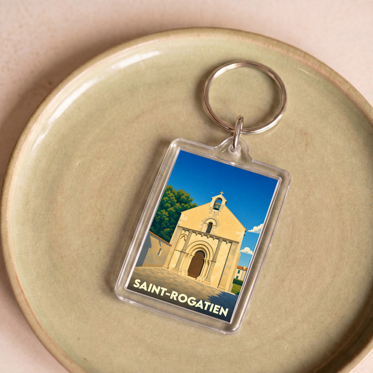 Porte-clés souvenir de la ville de Saint-Rogatien avec une illustration stylisée de son église.