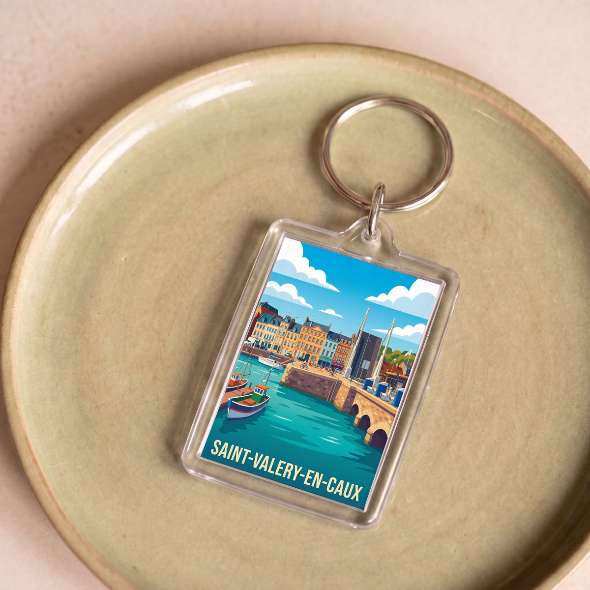 Porte-clés souvenir de la ville de Saint-Valery-en-Caux avec une illustration stylisée de son port.