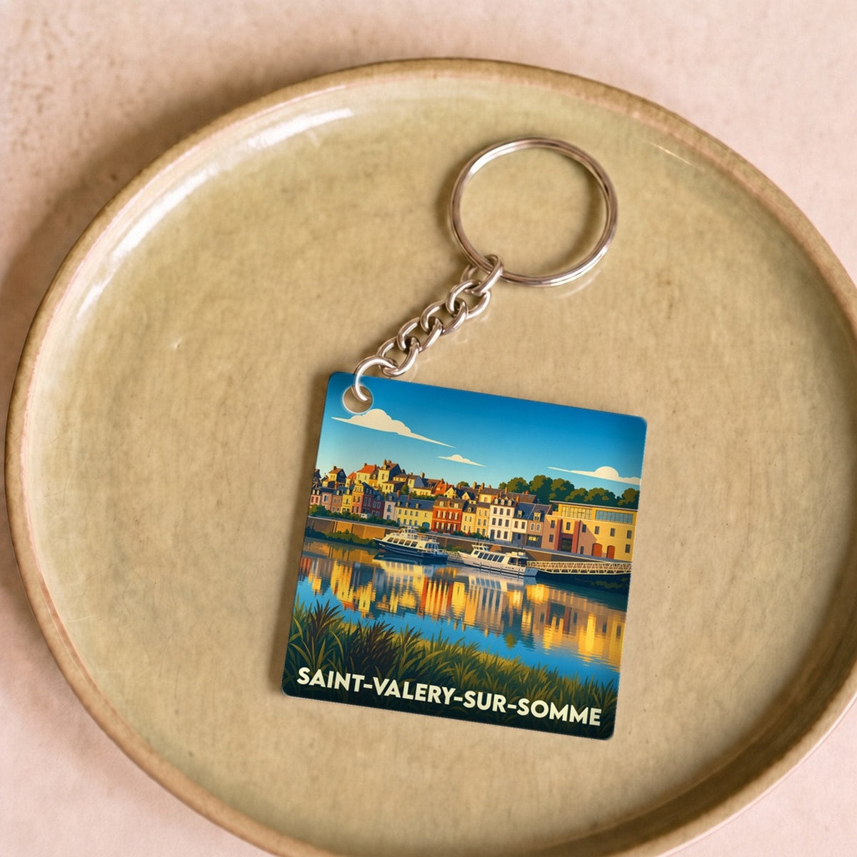 Porte-clés souvenir de la ville de Saint-Valery-sur-Somme avec une illustration stylisée.