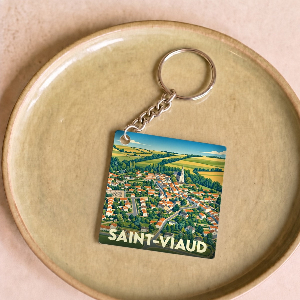 Porte-clés souvenir de la ville de Saint-Viaud avec une illustration stylisée.