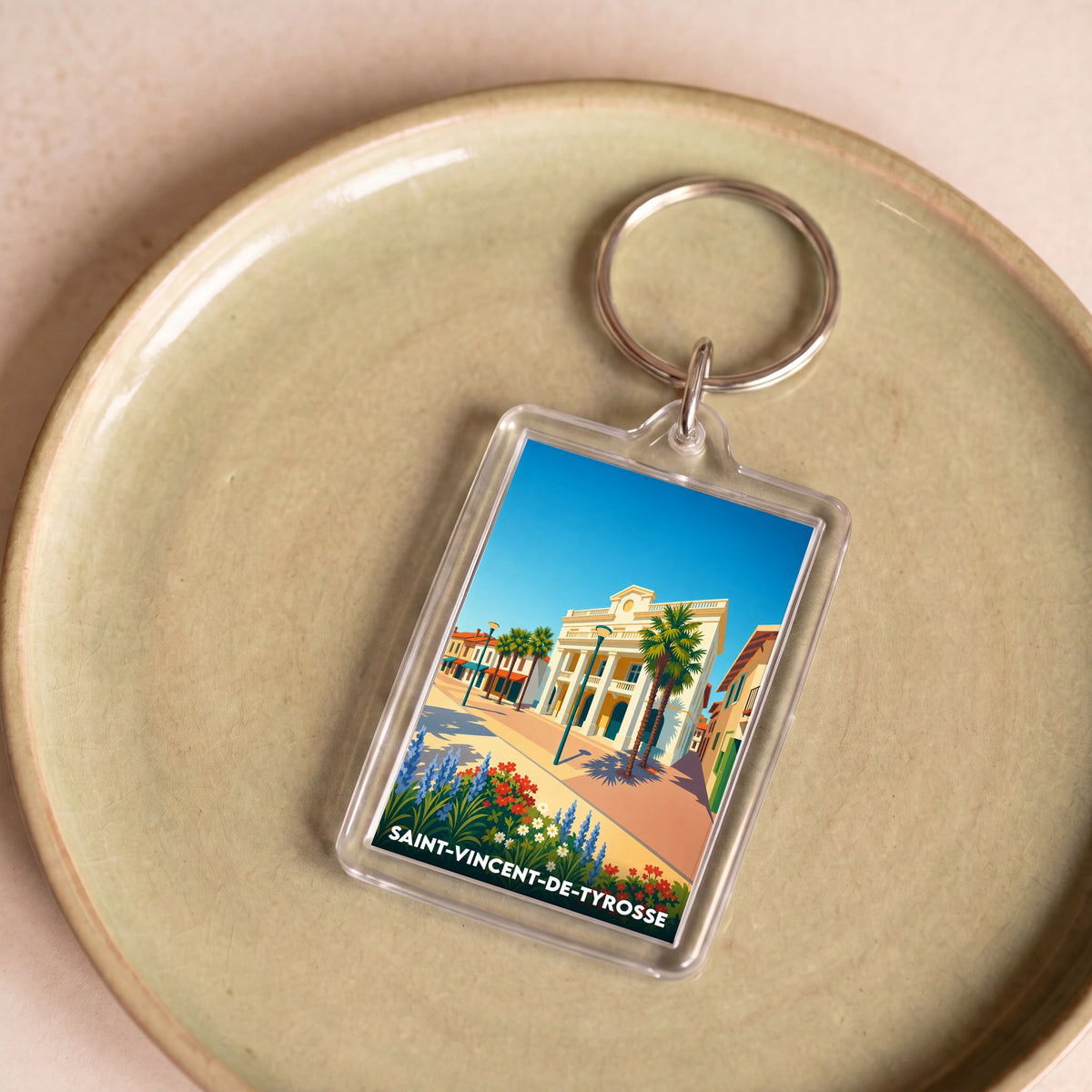 Porte-clés souvenir de la ville de Saint-Vincent-de-Tyrosse avec une illustration stylisée.