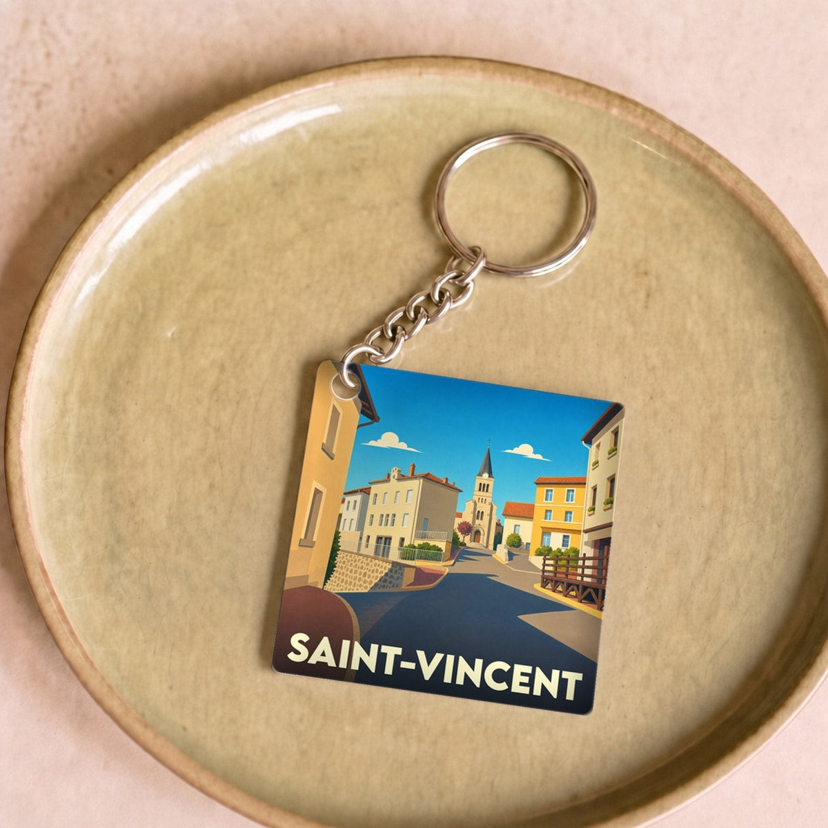 Porte-clés souvenir de la ville de Saint-Vincent avec une illustration stylisée.