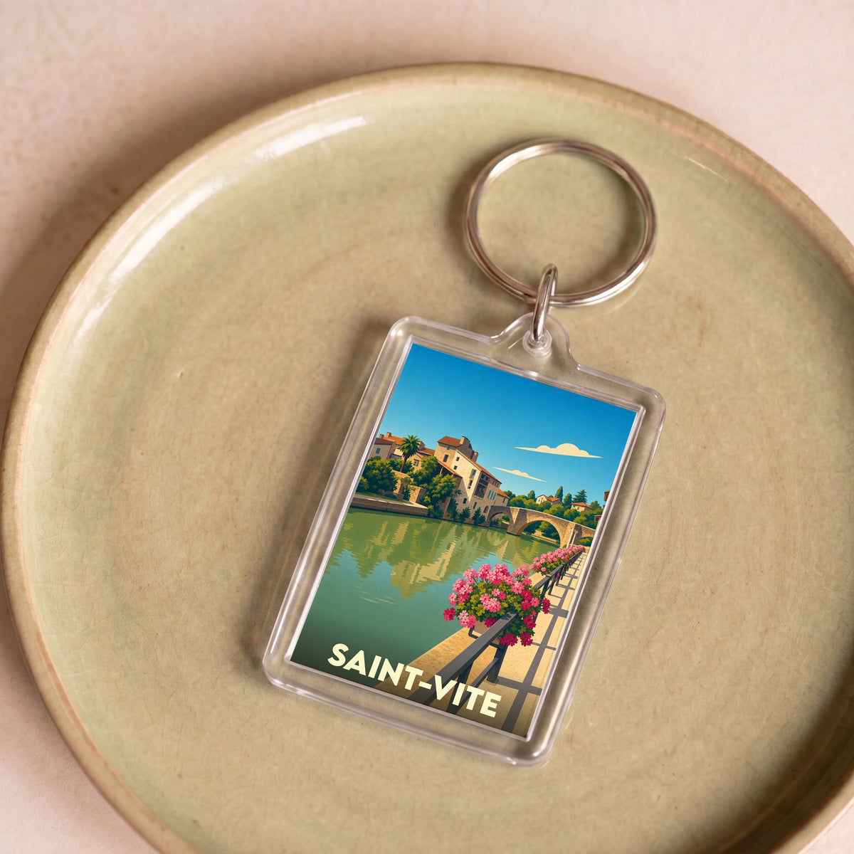 Porte-clés souvenir de la ville de Saint-Vite avec une illustration stylisée.