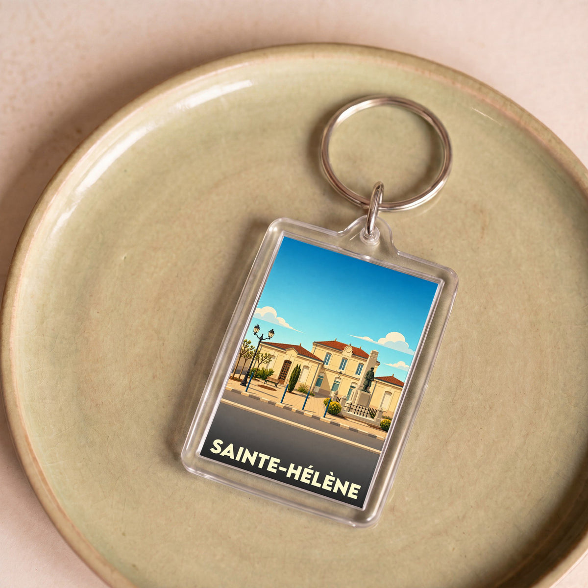 Porte-clés souvenir de la ville de Sainte-Hélène avec une illustration stylisée.