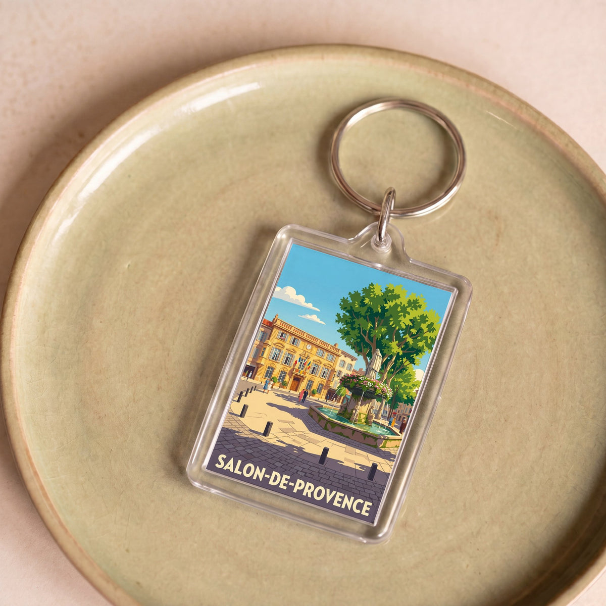 Porte-clés souvenir de la ville de Salon-de-Provence avec une illustration stylisée.