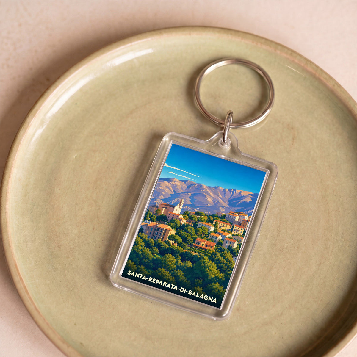 Porte-clés souvenir de la ville de Santa-Reparata-di-Balagna avec une illustration stylisée.