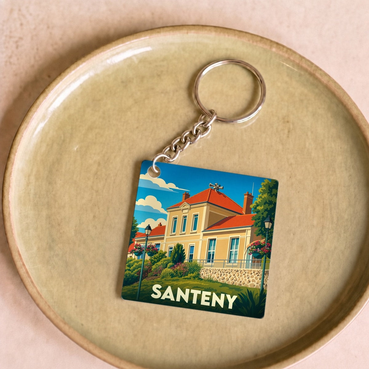 Porte-clés souvenir de la ville de Santeny avec une illustration stylisée.