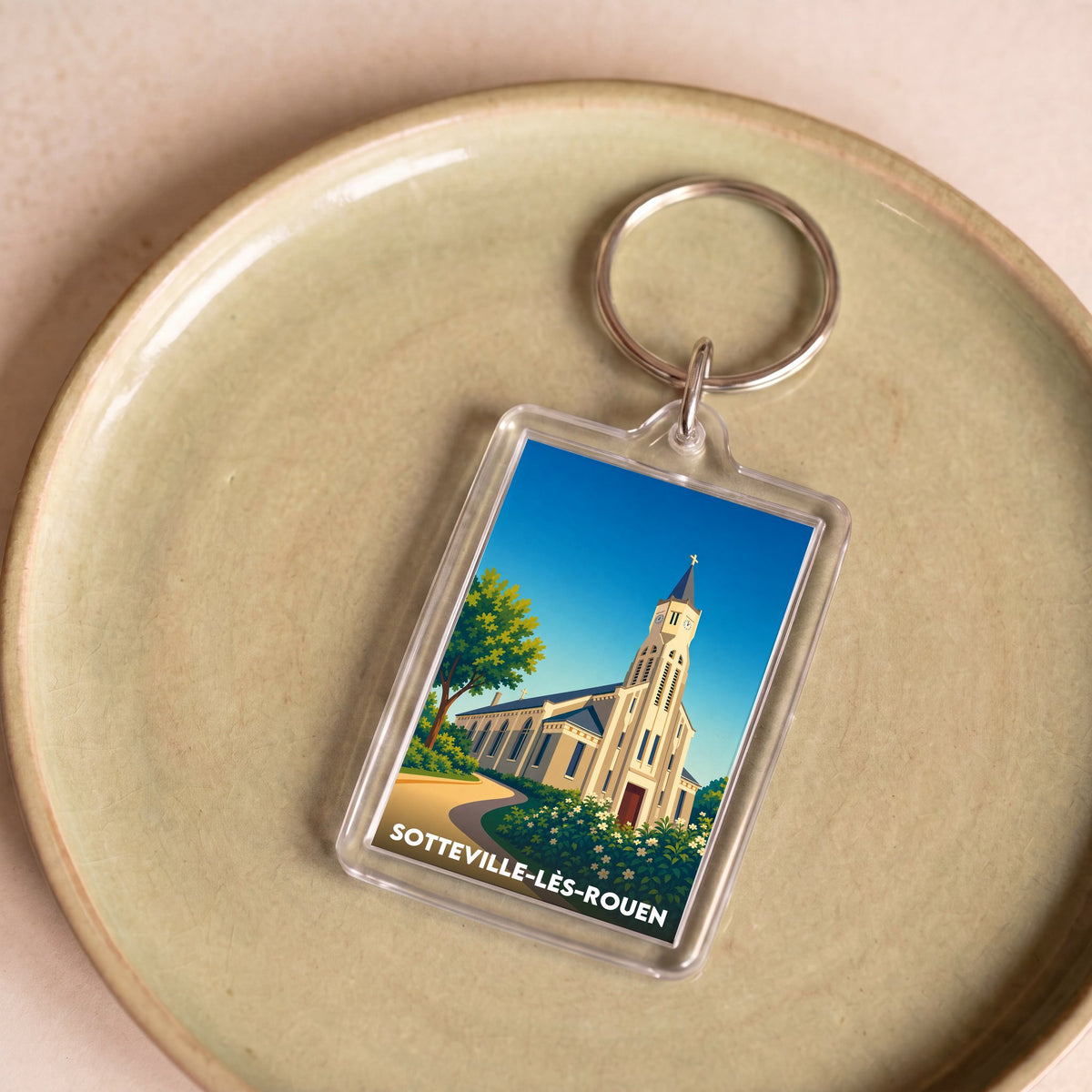 Porte-clés souvenir de Sotteville-lès-Rouen avec une illustration stylisée de son église.