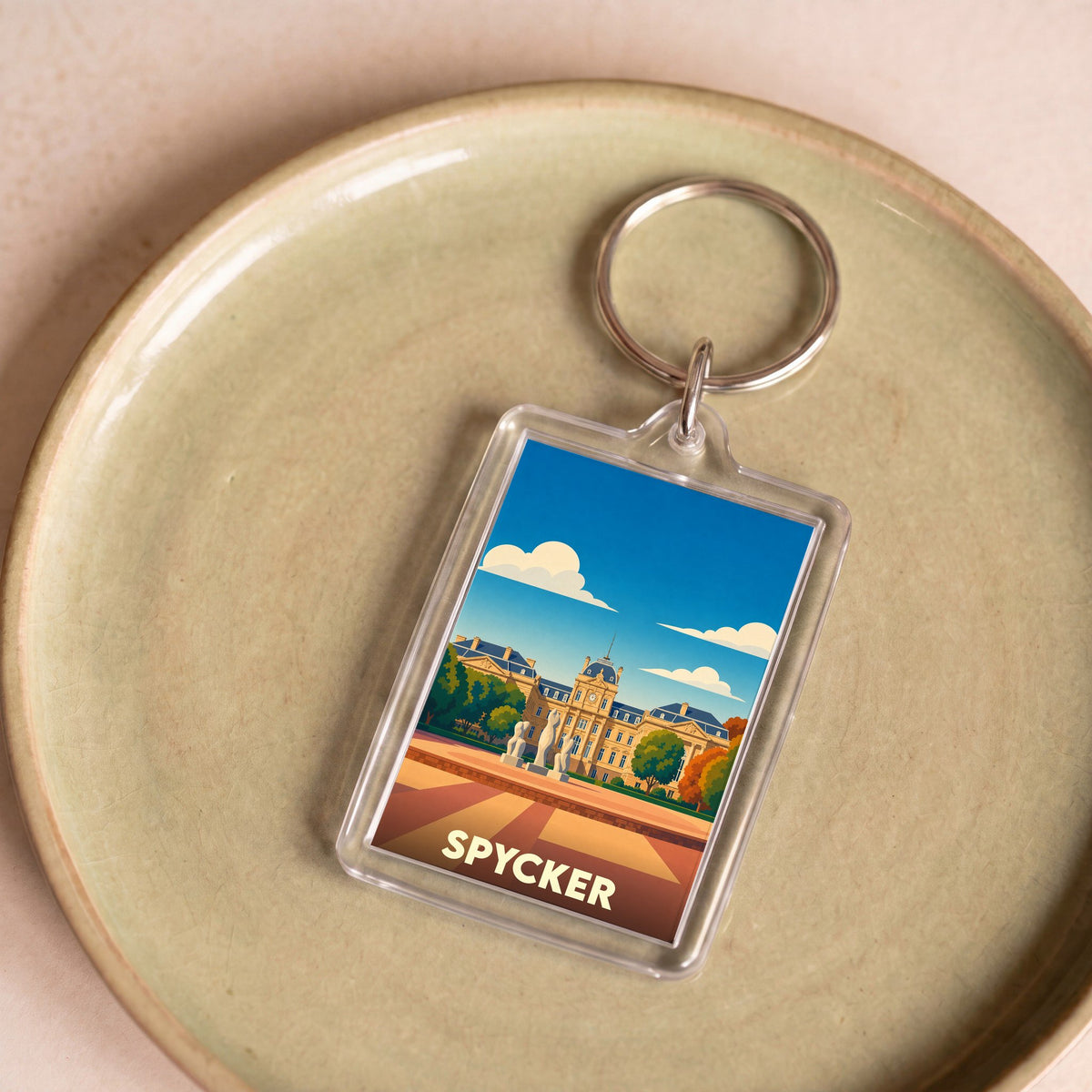 Porte-clés souvenir de la ville de Spycker avec une illustration stylisée.
