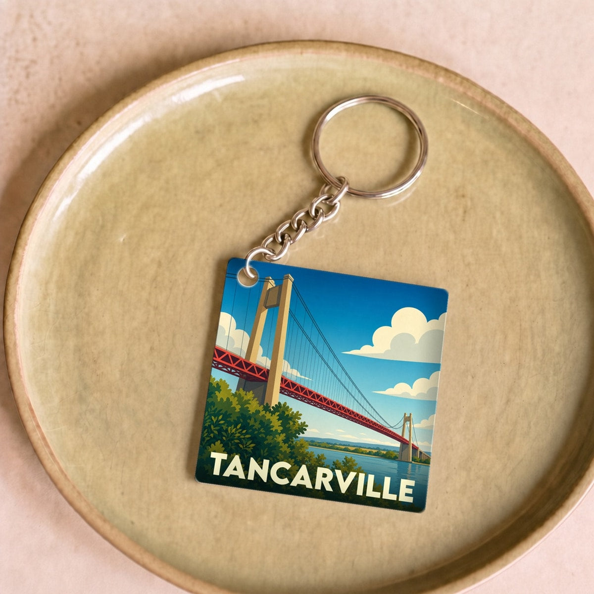 Porte-clés souvenir de la ville de Tancarville avec une illustration stylisée de son célèbre pont.
